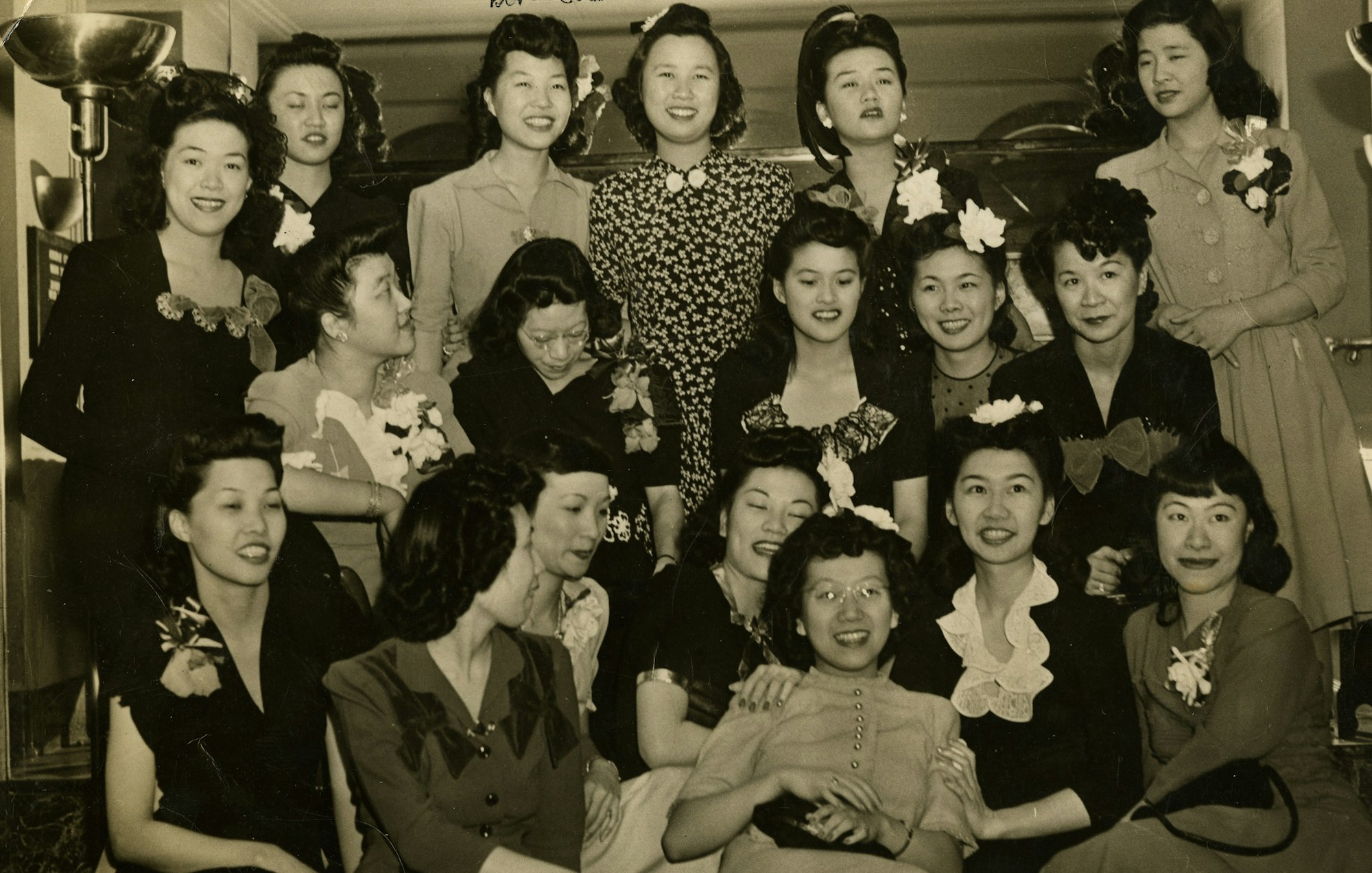 a group of young asian american women at a nightclub