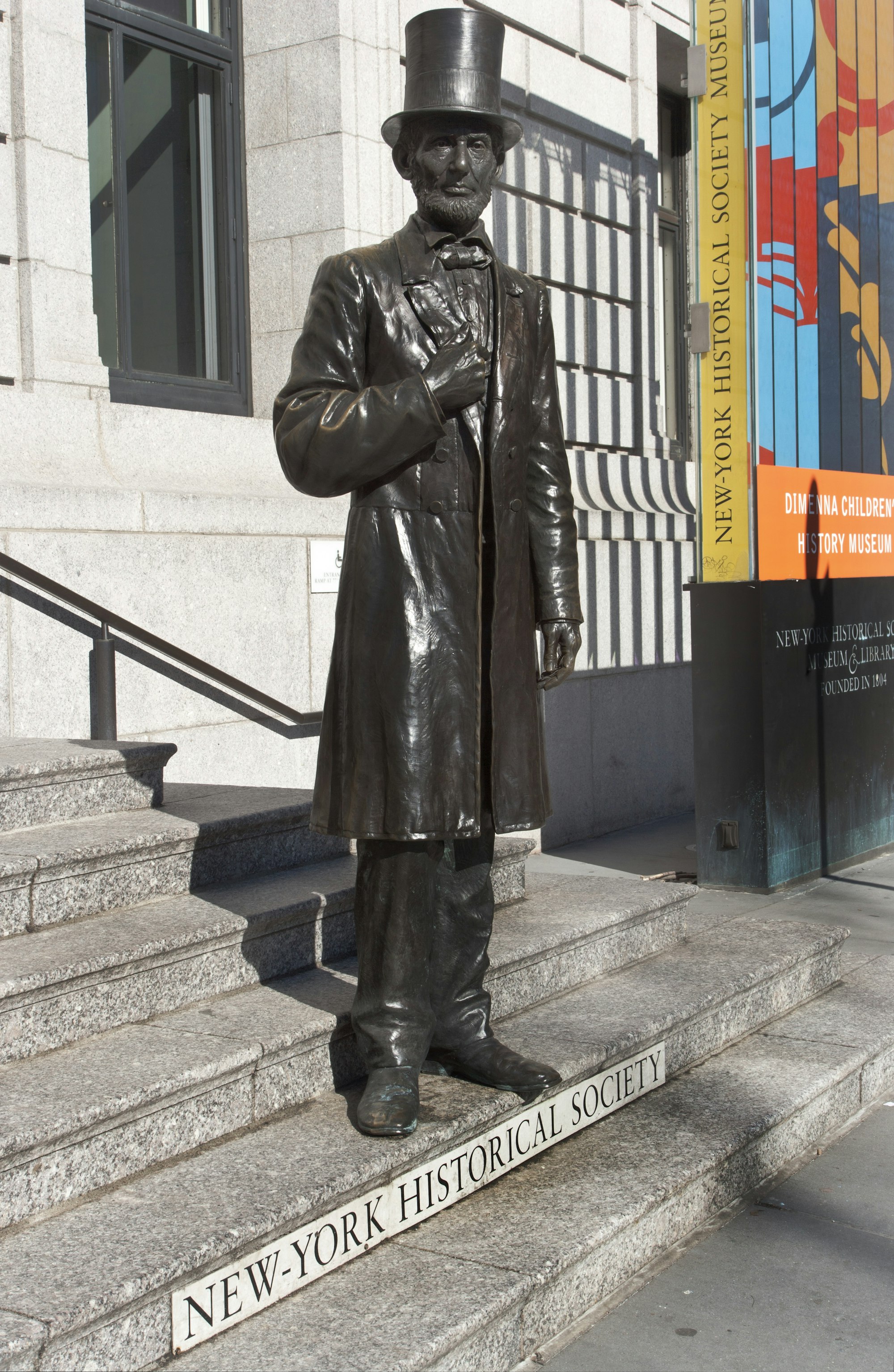 Abraham Lincoln statue outside of the central park west entrance, wearing a top hat