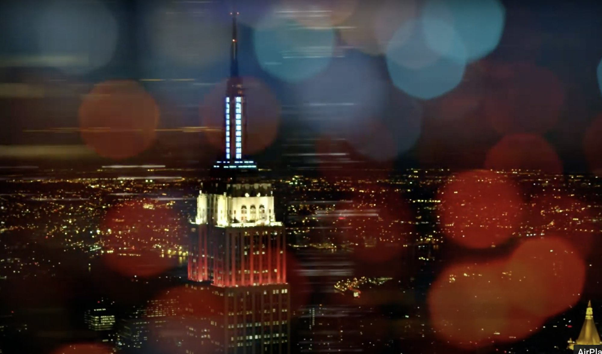 A still from the film new york story featuring a nighttime shot of the empire state building
