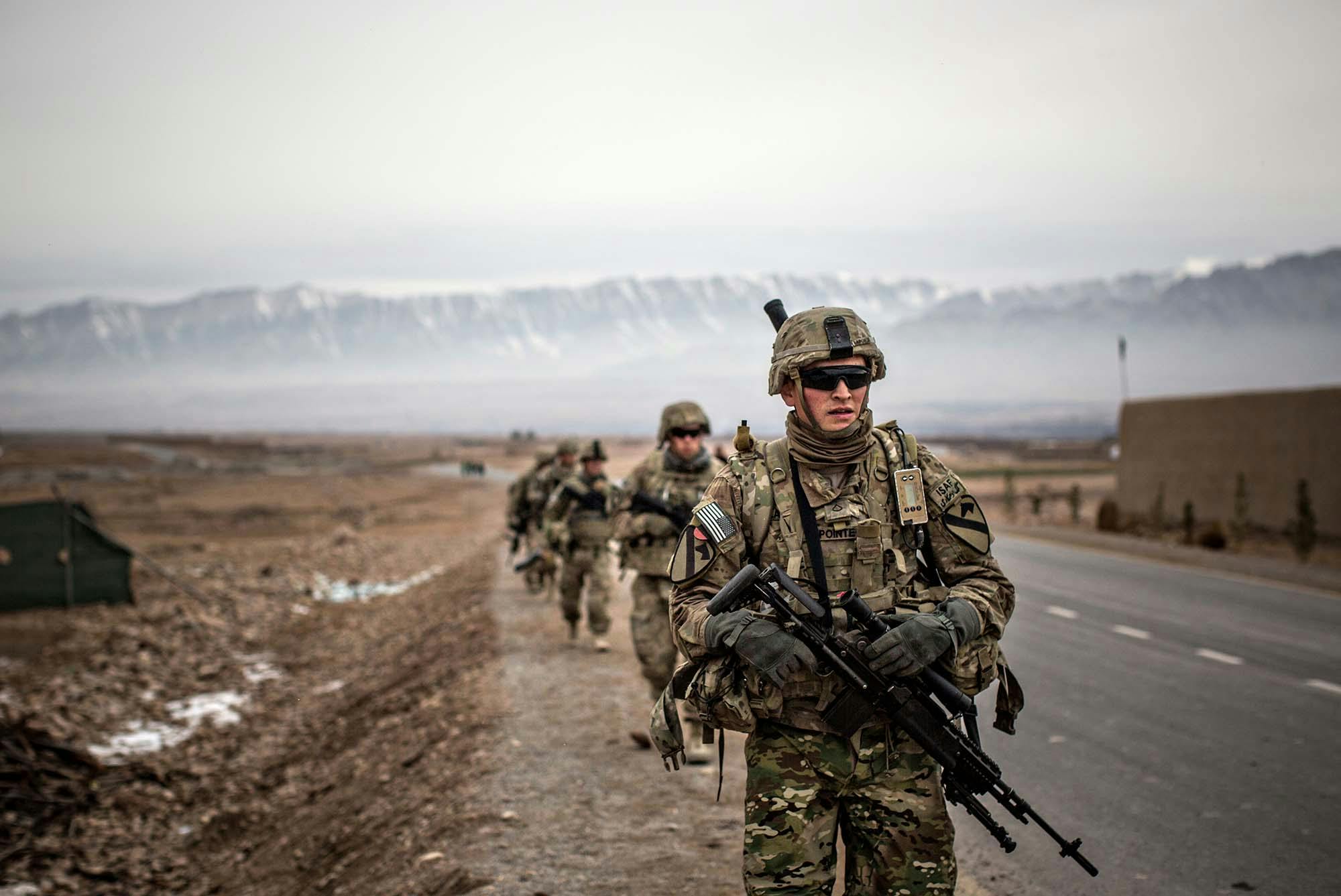 US Army soldiers with the 1st Cavalry Division conduct a patrol January 12, 2014 in Tirin Kot, Uruzgan province, Afghanistan. US Army Photo/Alamy Photo.