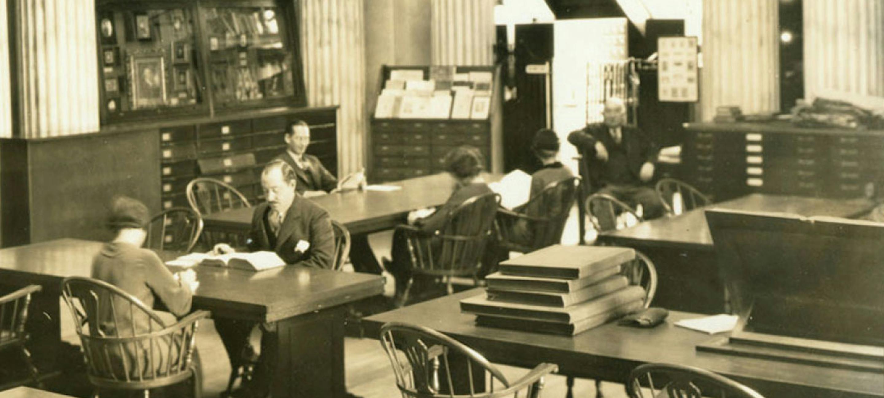 Sepia vintage photograph of people reading in the Patricia D. Klingenstein library Reading Room, circa 1935
