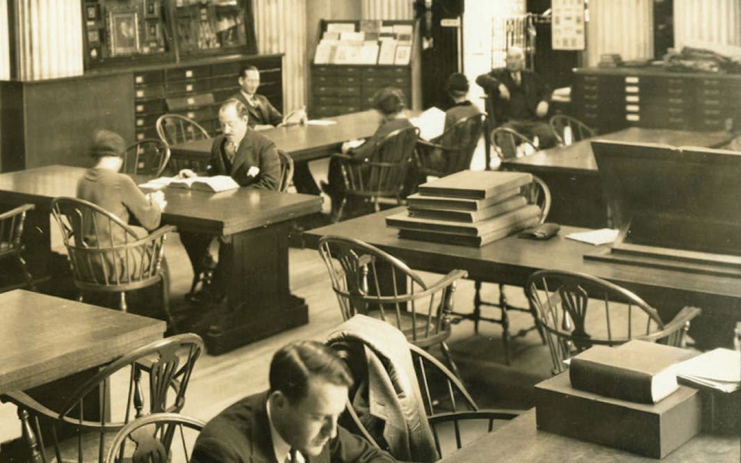 Sepia vintage photograph of people reading in the Patricia D. Klingenstein library Reading Room, circa 1935