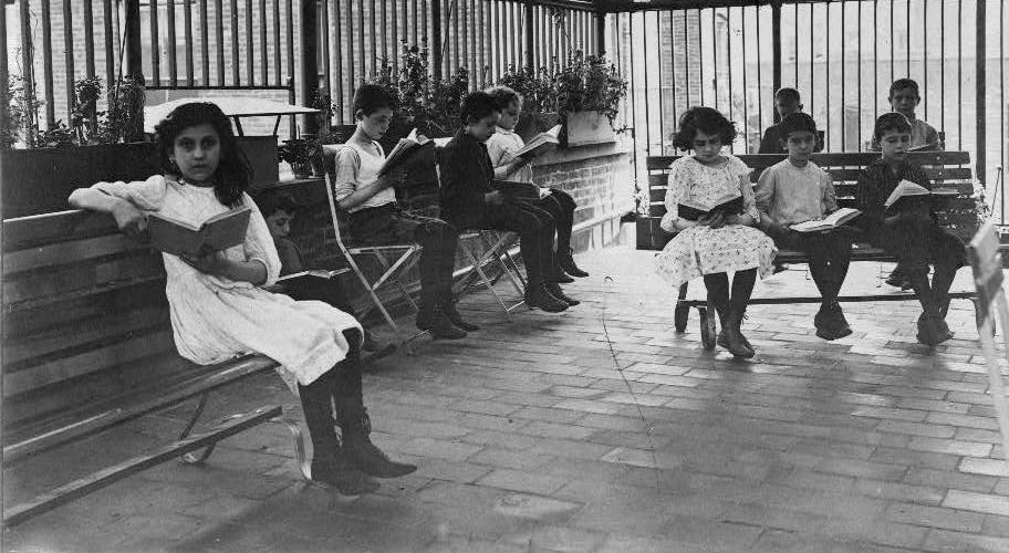 Children reading in roof garden of the Rivington St. Library, New York City, ca. 1919