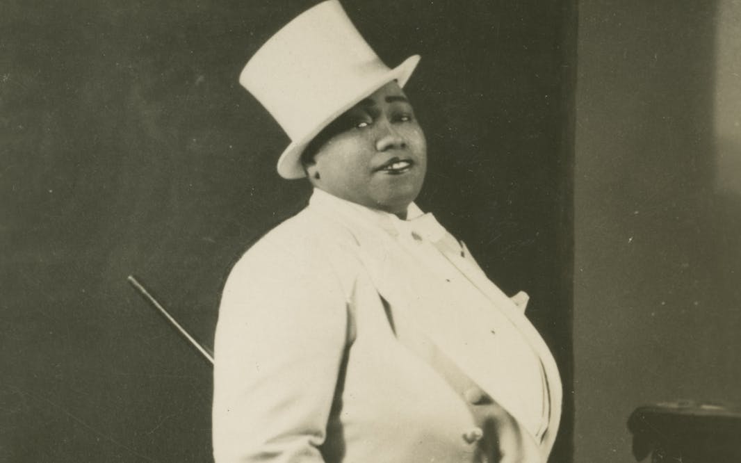 Unidentified photographer, Gladys Bentley, 1946-1949, a Black drag performer wearing a white tuxedo and top hat. Gelatin silver print. Collection of the Smithsonian National Museum of African American History and Culture