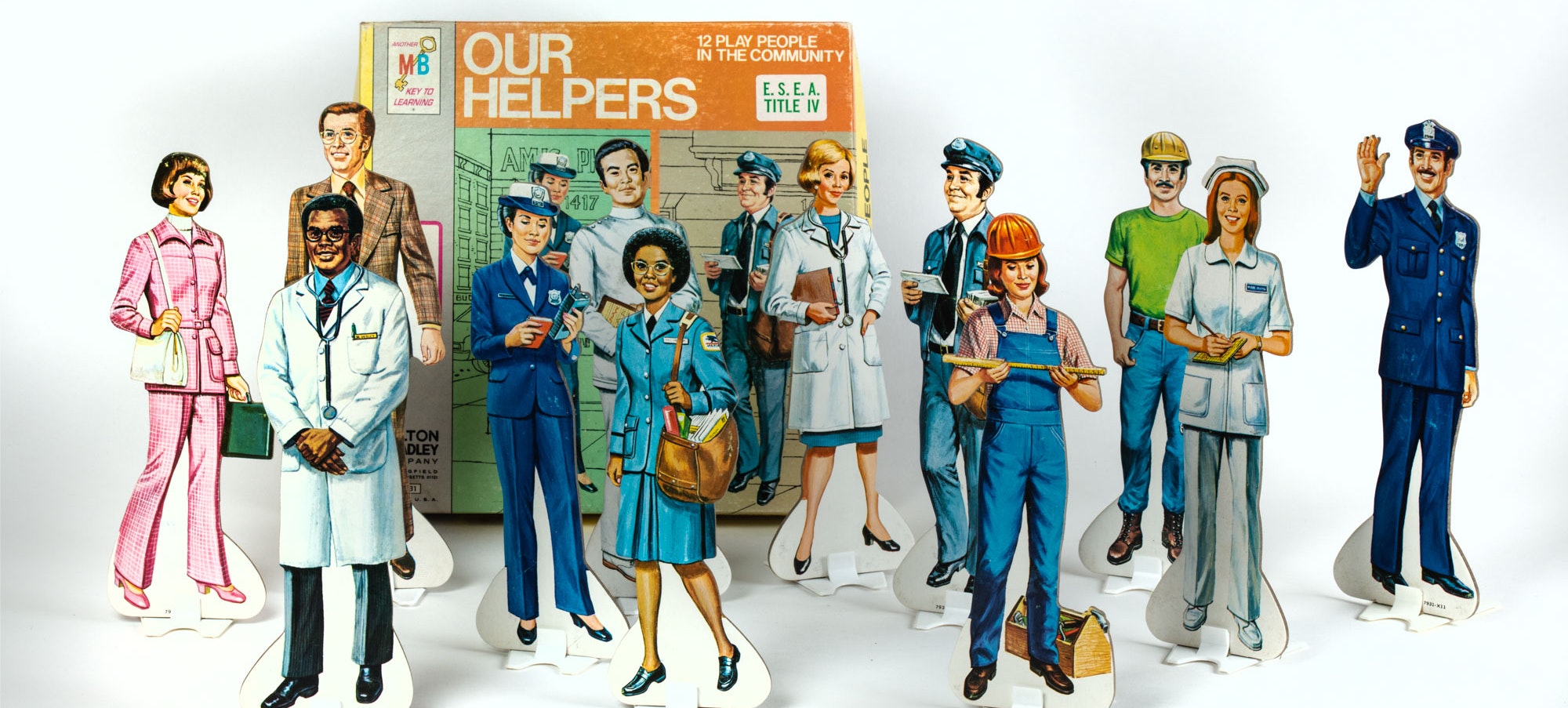 A line of paper dolls from the 1970s showing different careers