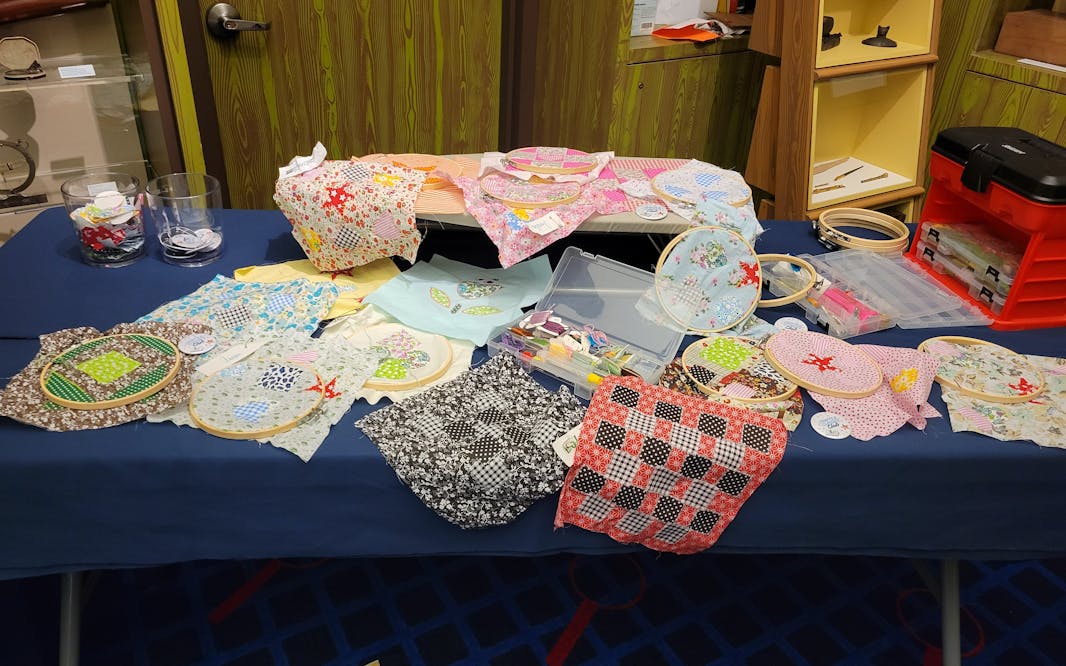 table with handmade sewing craft