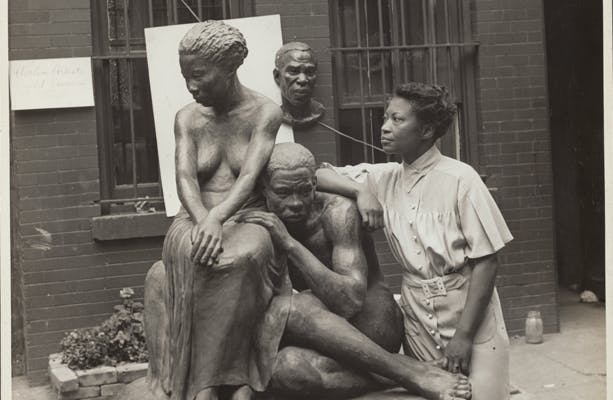 Andrew Herman (active 1930s–1940s), Federal Art Project, Works Progress Administration, Augusta Savage with her sculpture Realization, 1938. Schomburg Center for Research in Black Culture, NYPL, Photographs and Prints Division, Astor, Lenox and Tilden Foundations, 86-0036.