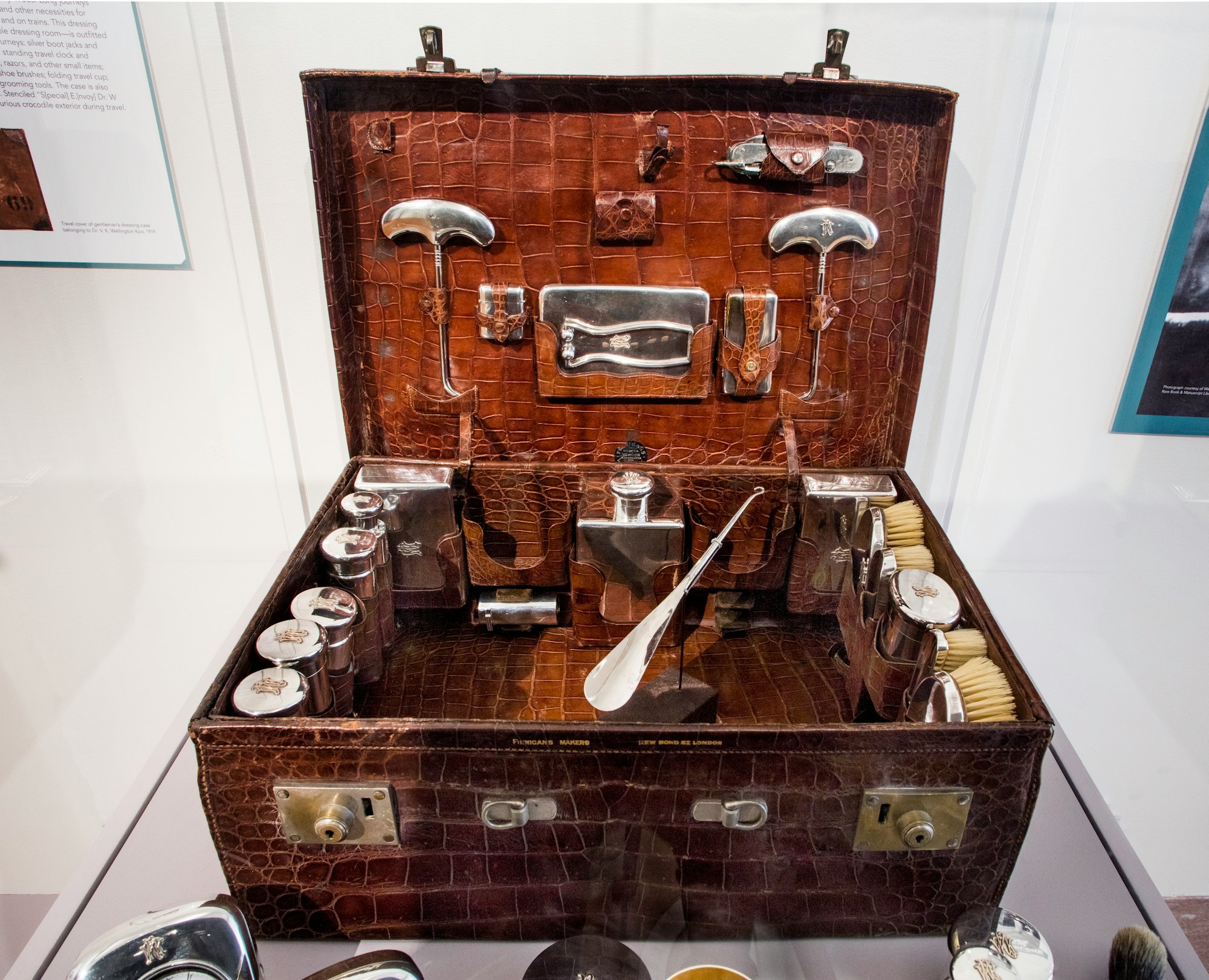 Fancy gentleman's leather dressing case with a lot of silver bottles and instruments