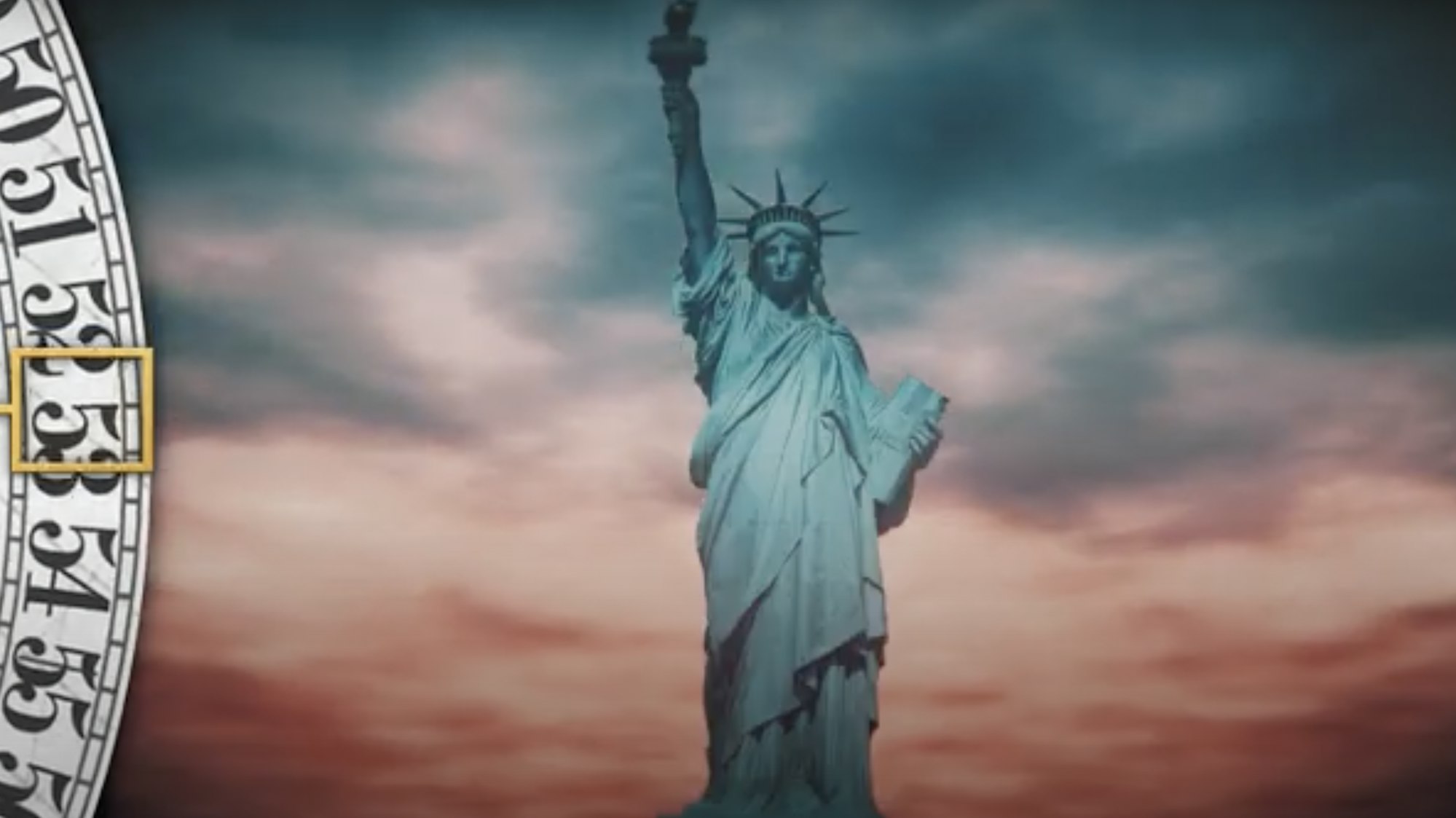 a screen shot from the History minute video showing the statue of liberty against a blue and red sky