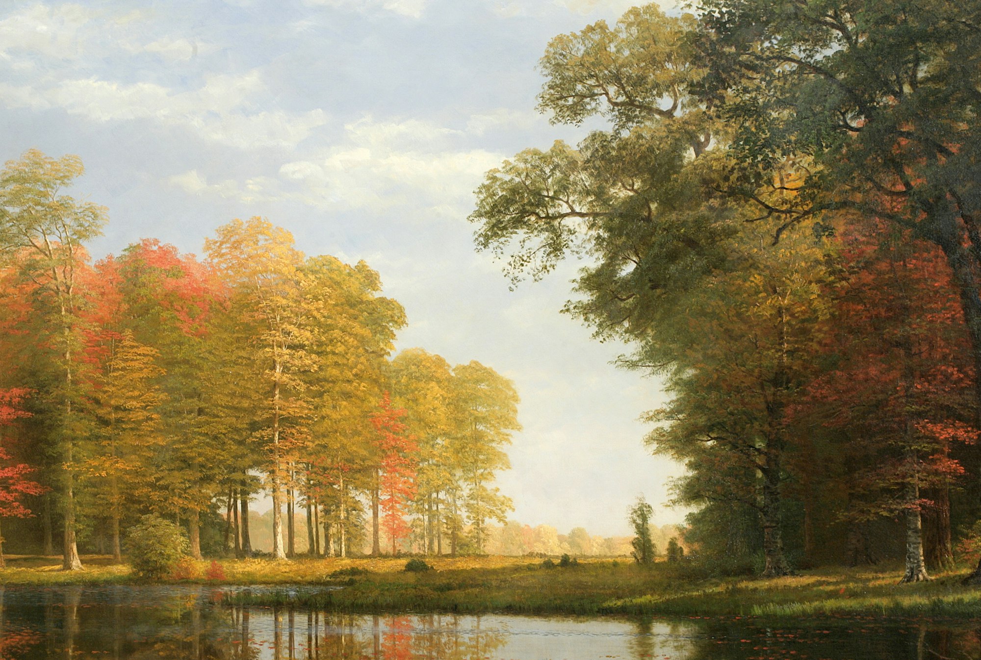 Albert Bierstadt's oil on canvas work Autumn Woods, Oneida County, State of New York, ca. 1886 , depicting stands of trees along a waterway