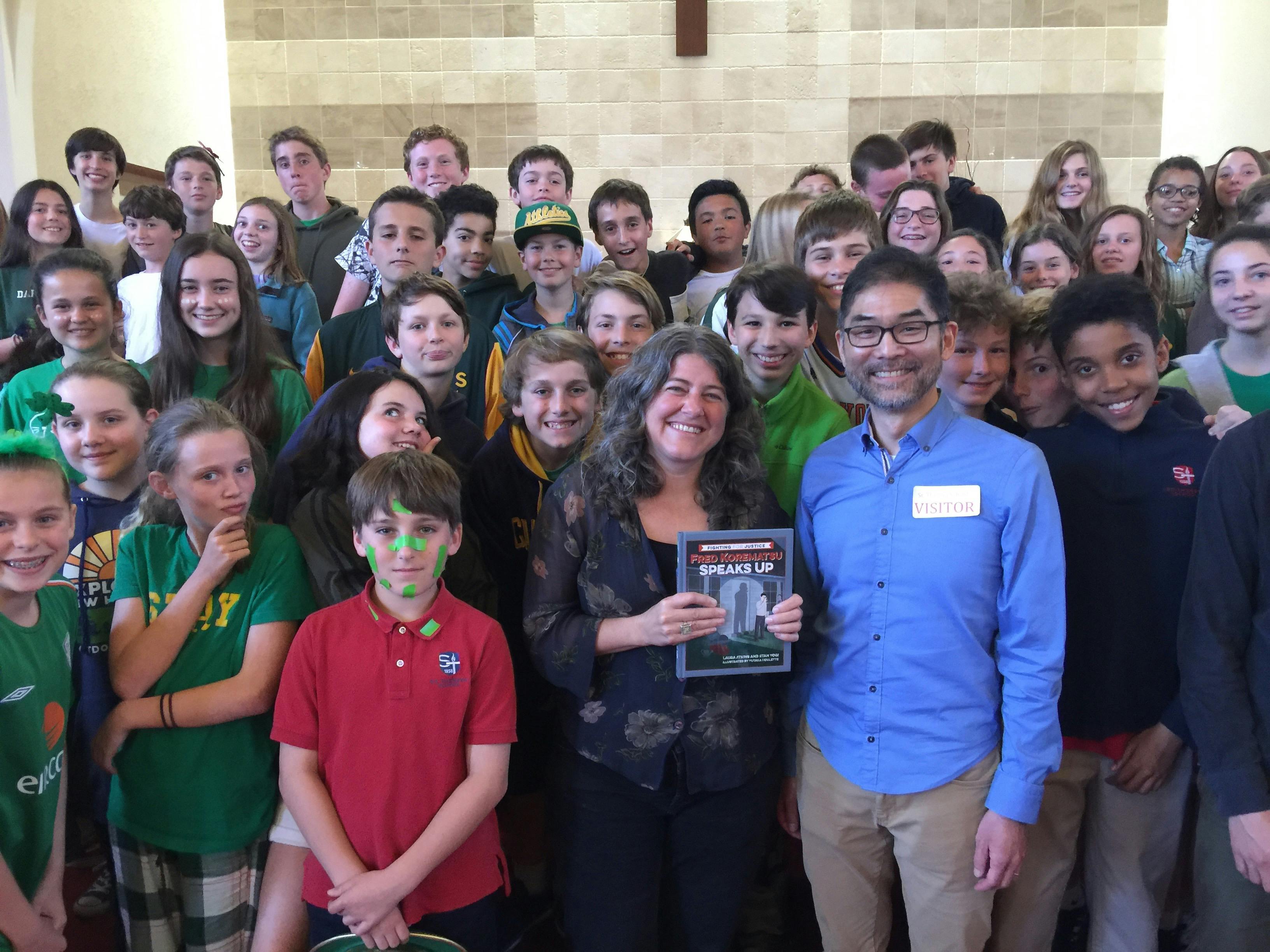 children gathered around the winners of the Children's History Book Prize