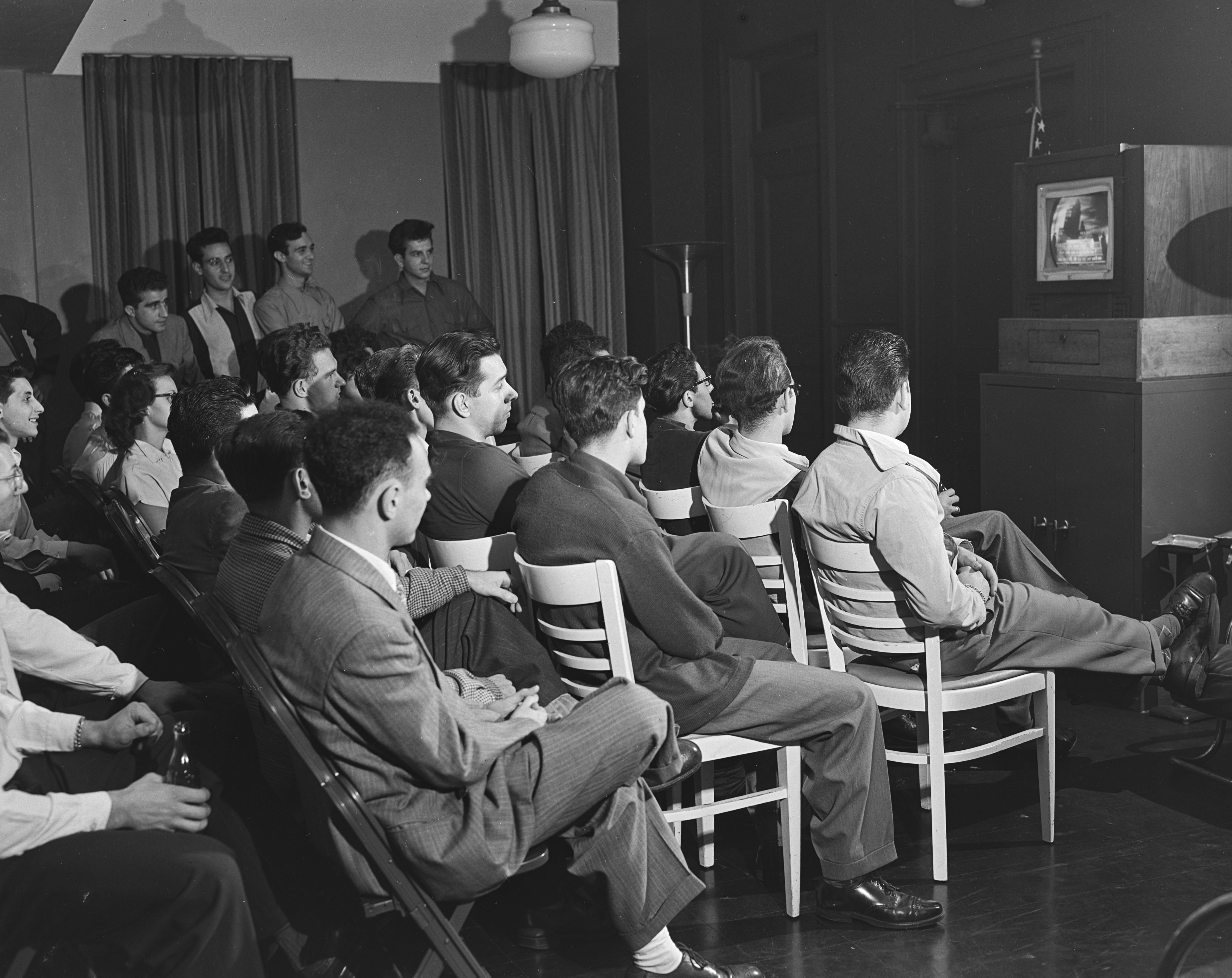 Group of teenage boys watching a television at the Tompkins Square Building [i.e. Harriman Clubhouse], Lower East Side, New York City in 1949