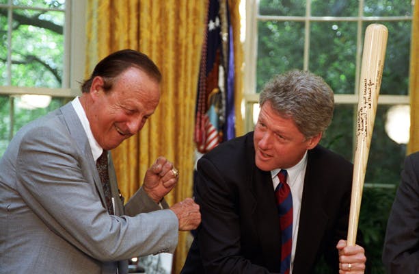 President Bill Clinton receives a bat from St. Louis Cardinals Hall of Famer Stan Musial, May 6, 1993